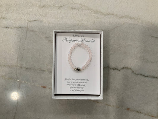 Pink Baby’s first bracelet w/cross